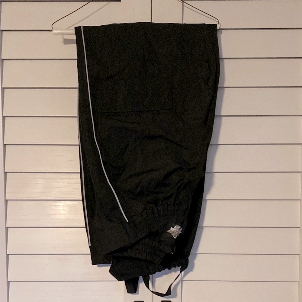 Waterproof overpants with leg zip up and reflective stripe
